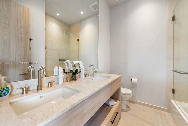 bathroom featuring toilet, tile patterned floors, a shower with shower door, and vanity