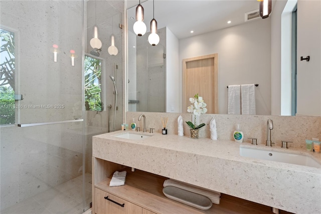 bathroom with an enclosed shower and vanity