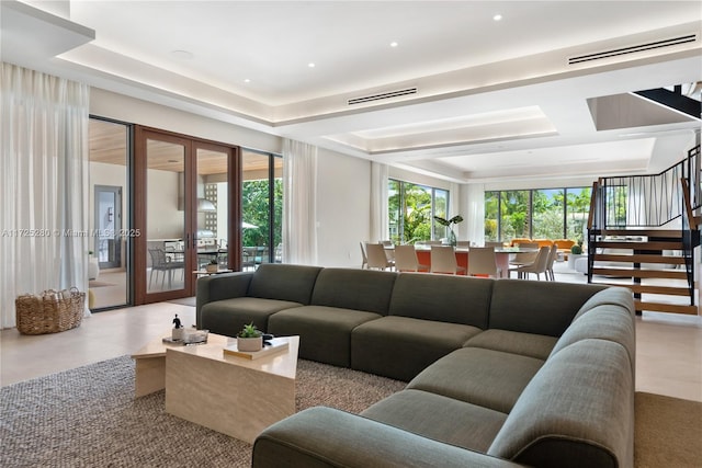 living room featuring a tray ceiling