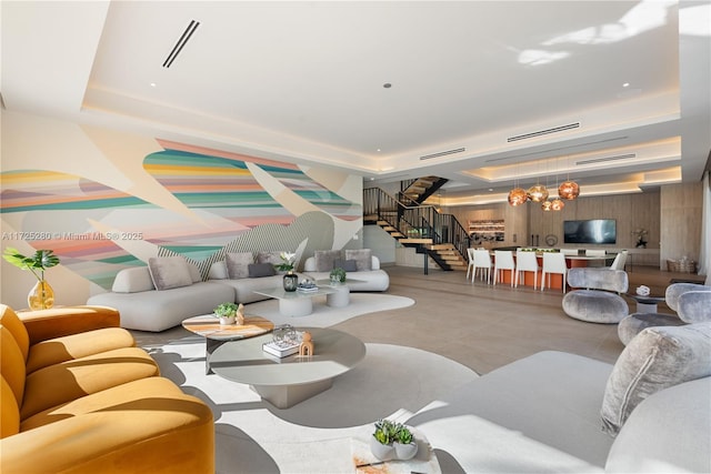 living room featuring a tray ceiling