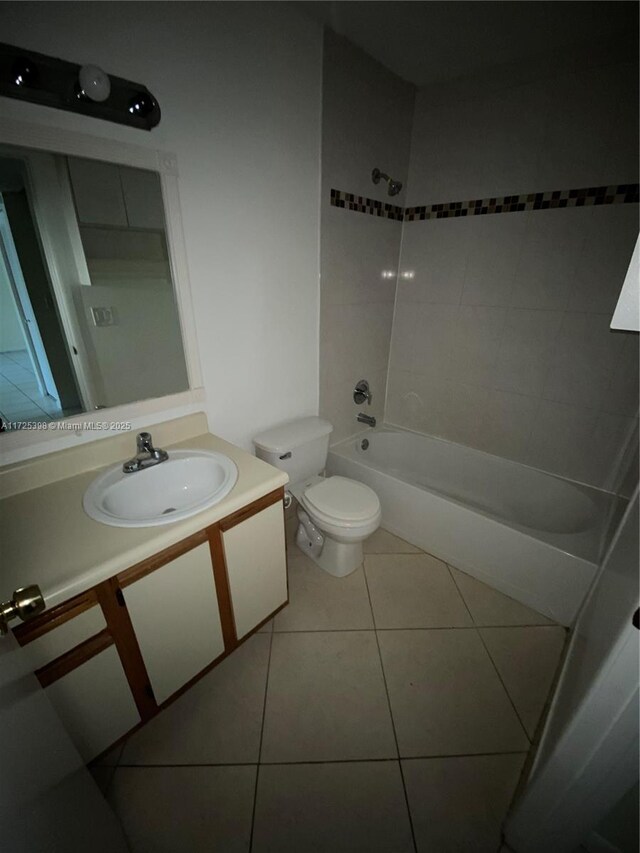 full bathroom featuring toilet, tile patterned flooring, shower / bathtub combination, and vanity