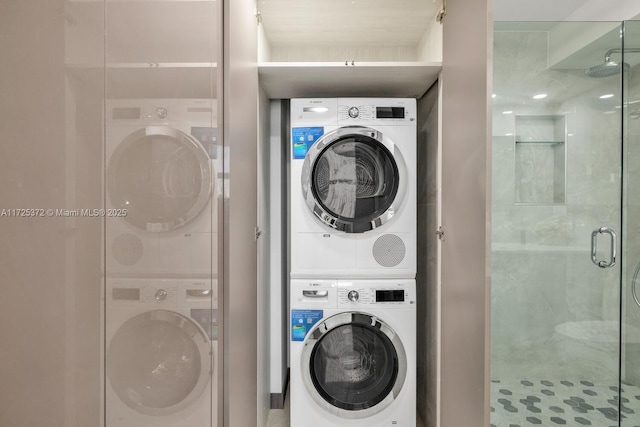 laundry area with stacked washing maching and dryer