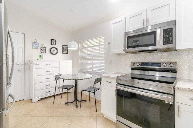 kitchen with crown molding, pendant lighting, stainless steel appliances, and white cabinetry