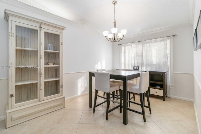 tiled dining room with a notable chandelier and ornamental molding