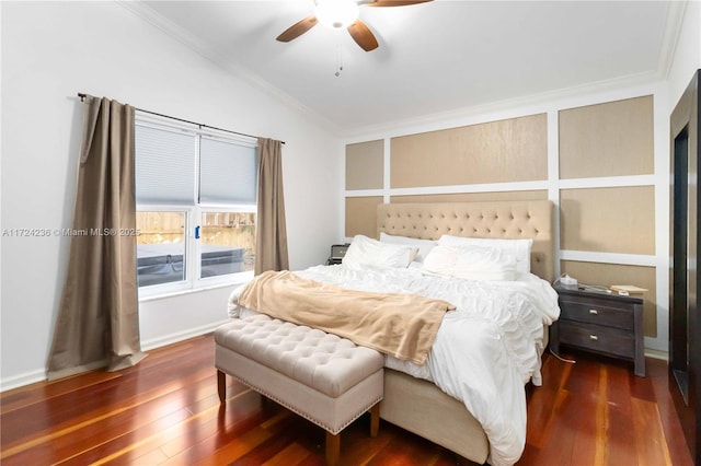 bedroom featuring ceiling fan, dark hardwood / wood-style floors, ornamental molding, and vaulted ceiling