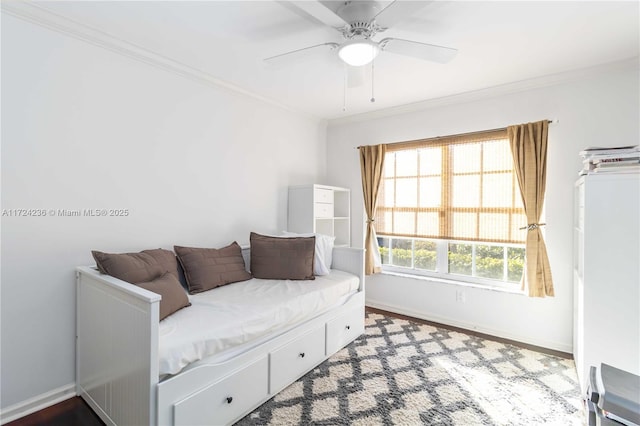 interior space with ceiling fan and crown molding