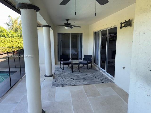 view of patio featuring ceiling fan