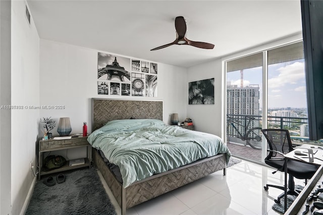 bedroom featuring multiple windows, ceiling fan, access to outside, and expansive windows