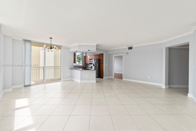 unfurnished living room featuring an inviting chandelier, ornamental molding, and light tile patterned floors