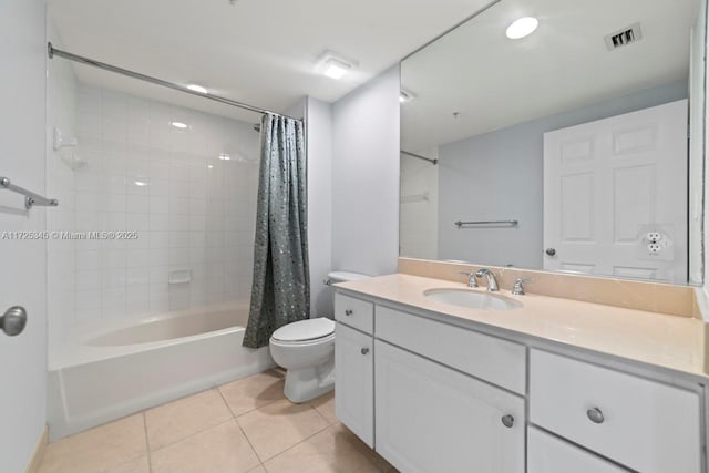 full bathroom featuring toilet, tile patterned flooring, shower / bath combo, and vanity