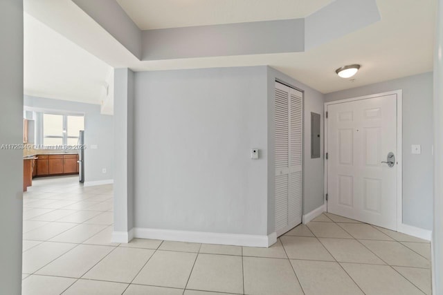 entryway featuring electric panel and light tile patterned floors