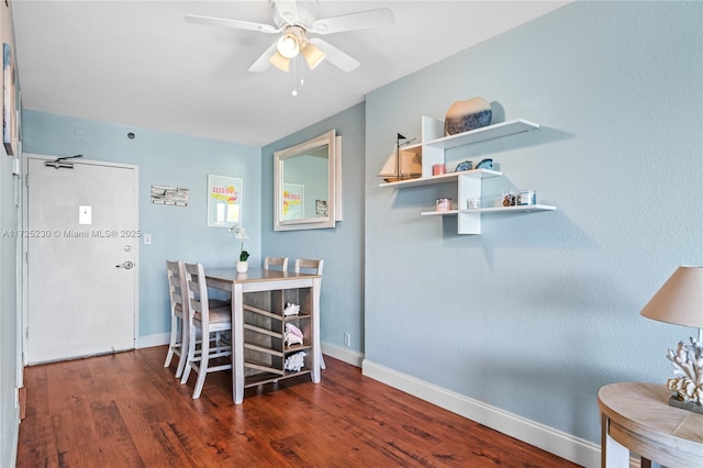 dining area with ceiling fan and dark wood-type flooring