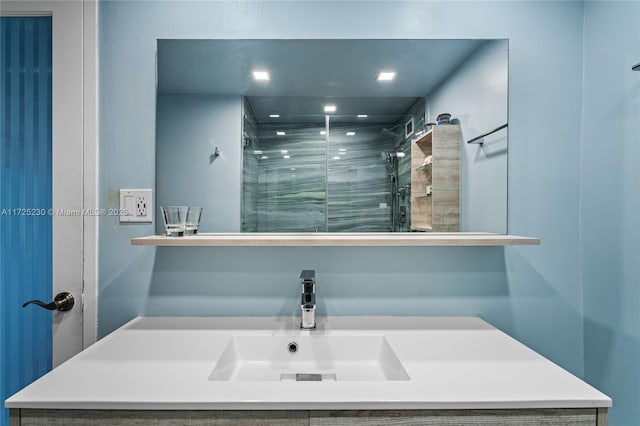 bathroom featuring sink and tiled shower