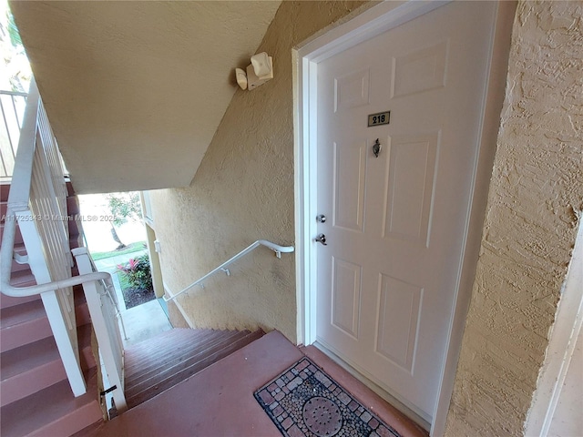 property entrance featuring stucco siding