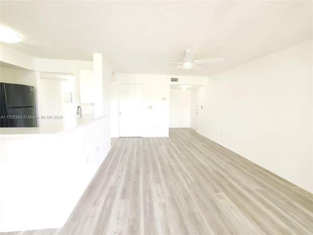 2600 S University Dr Unit 218, Davie, FL 33328 - kitchen with visible vents, light countertops, a textured ceiling, and appliances with stainless steel finishes
