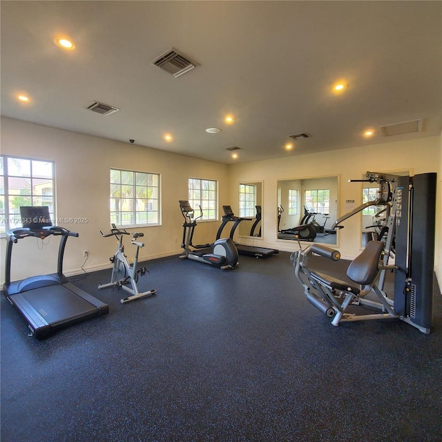 exercise room with visible vents and a healthy amount of sunlight