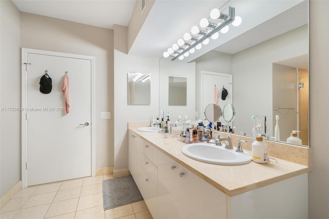 bathroom with vanity and tile patterned floors