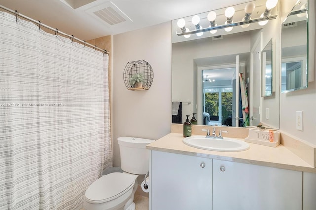 bathroom with toilet and vanity