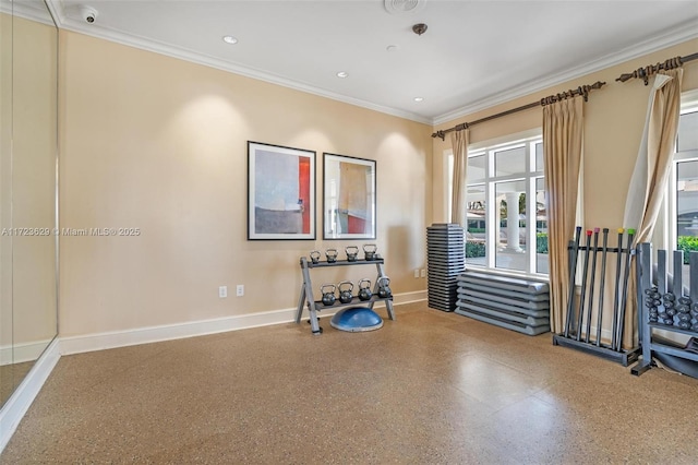 exercise room featuring crown molding