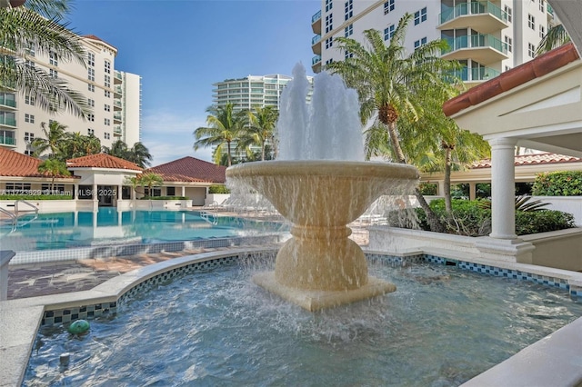 view of swimming pool featuring pool water feature