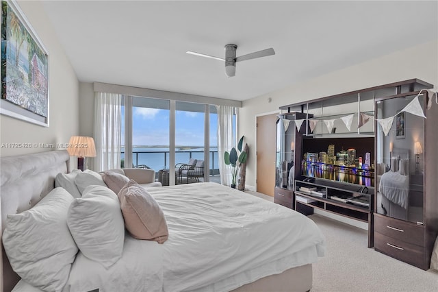 carpeted bedroom featuring ceiling fan and access to exterior