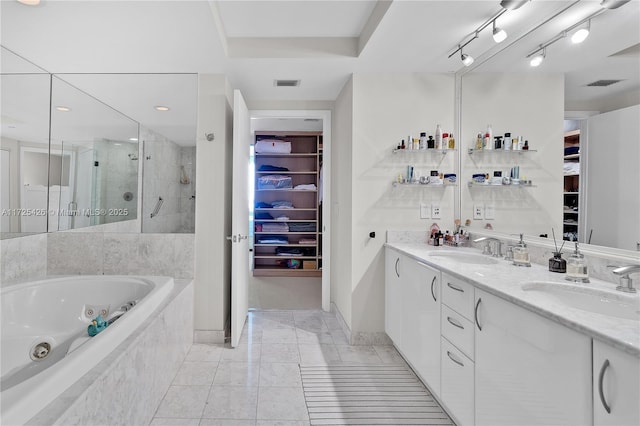 bathroom with separate shower and tub and vanity