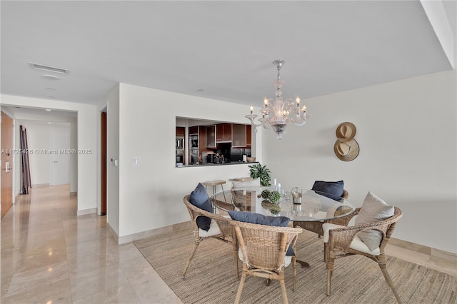 dining room featuring a chandelier