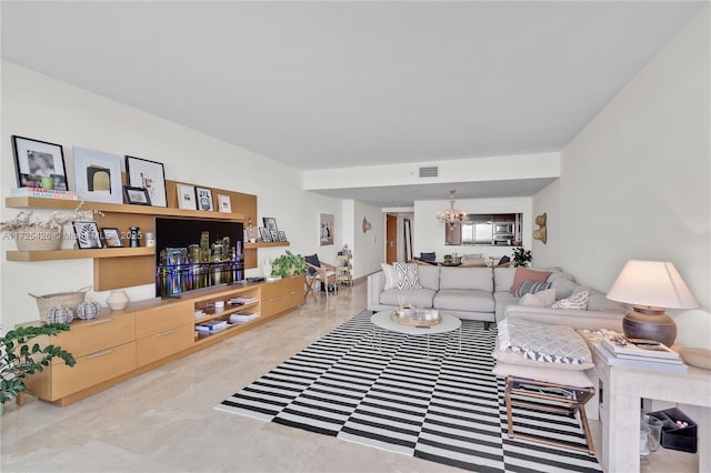 living room featuring a notable chandelier