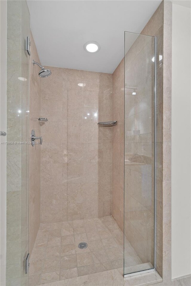 bathroom with a shower with shower door