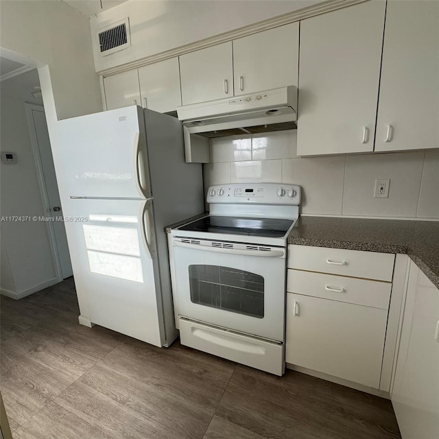 kitchen featuring white appliances and decorative backsplash