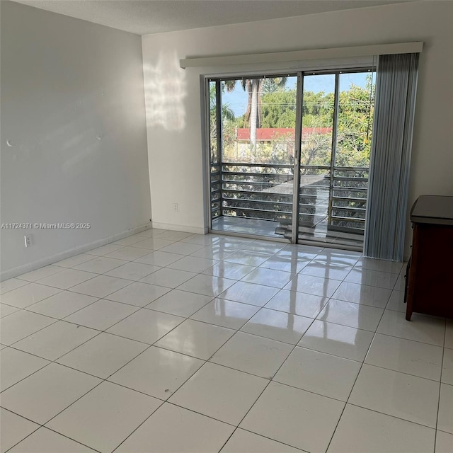 empty room with light tile patterned floors