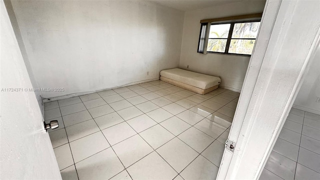 bathroom with tile patterned floors