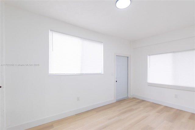 spare room featuring light hardwood / wood-style flooring