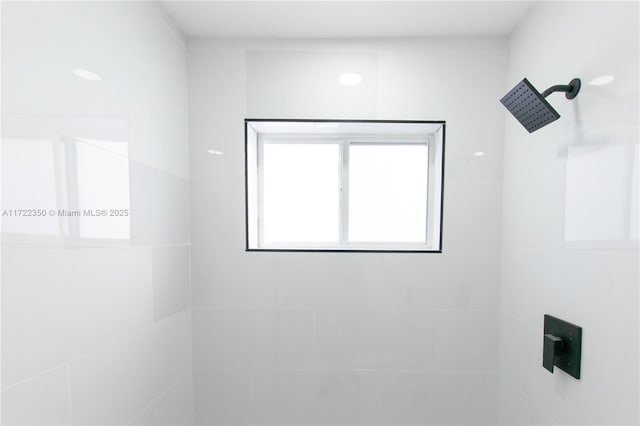 bathroom with a tile shower