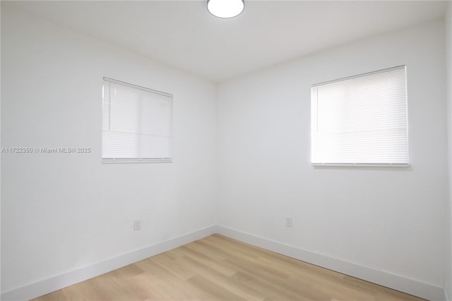 unfurnished room featuring wood-type flooring