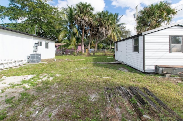 view of yard featuring central air condition unit