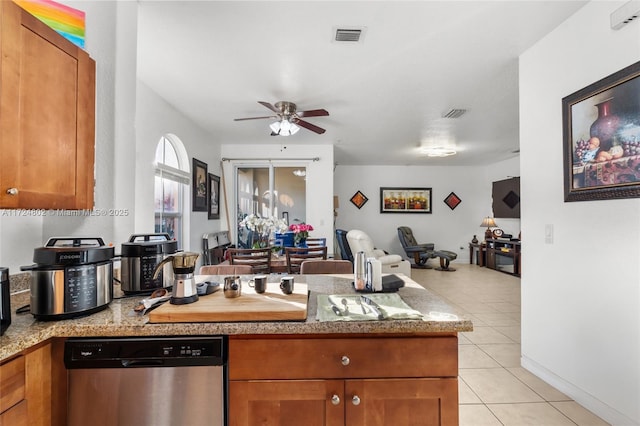 kitchen featuring ceiling fan, dishwasher, and light tile patterned floors