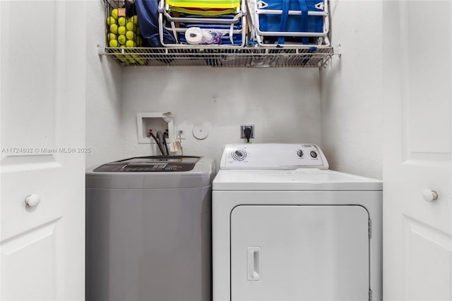 laundry room featuring separate washer and dryer