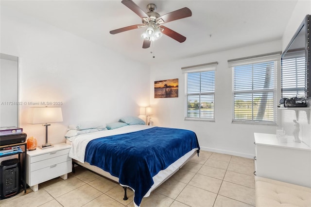 bedroom featuring ceiling fan and light tile patterned flooring