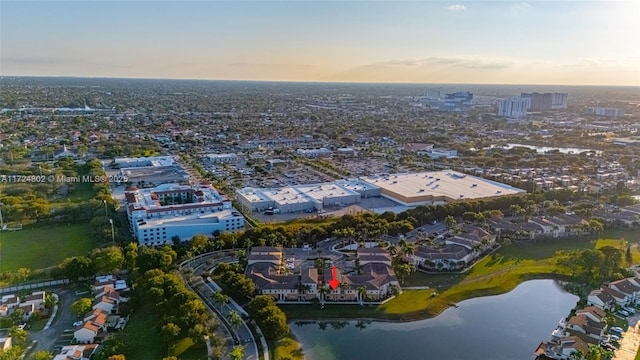 aerial view at dusk with a water view