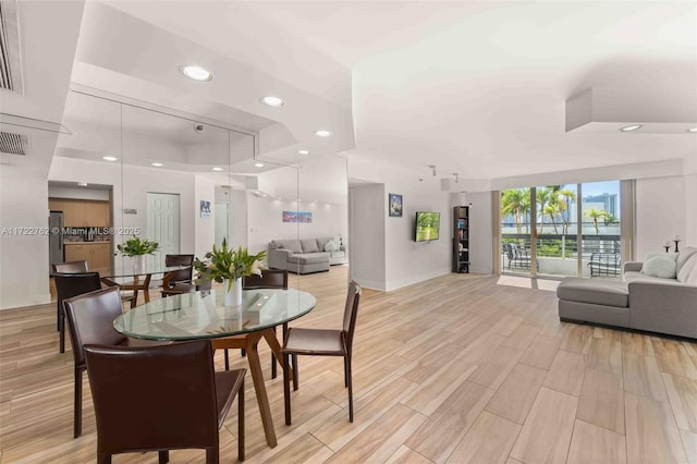 dining area featuring expansive windows