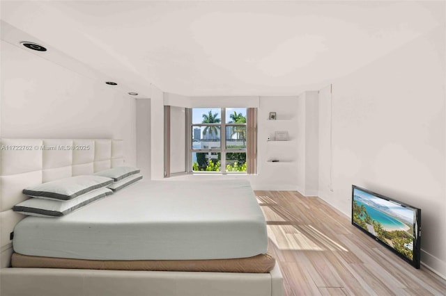 bedroom with light hardwood / wood-style flooring