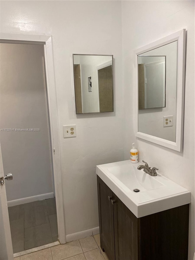 bathroom with tile patterned flooring and vanity