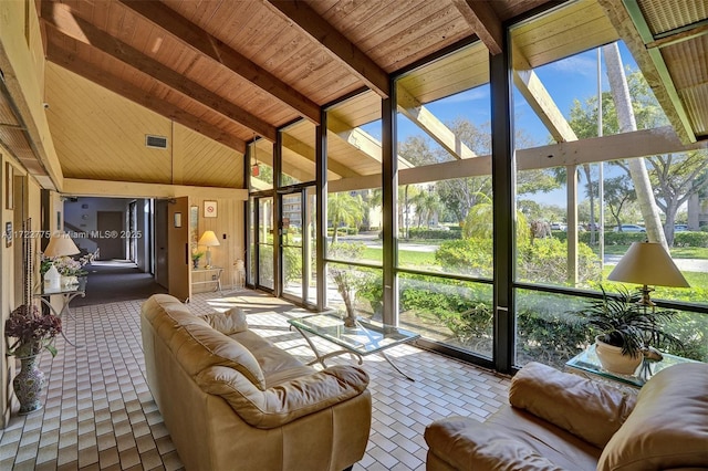 sunroom / solarium with wooden ceiling, lofted ceiling with beams, and a wealth of natural light