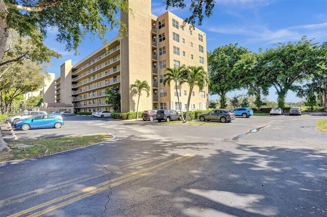 4570 NW 18th Ave Unit 202, Deerfield Beach, FL 33064 - view of apartment building / complex with uncovered parking