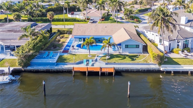 birds eye view of property featuring a water view