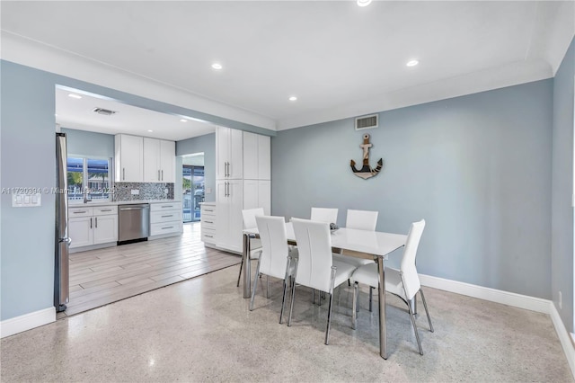 dining space with light hardwood / wood-style floors