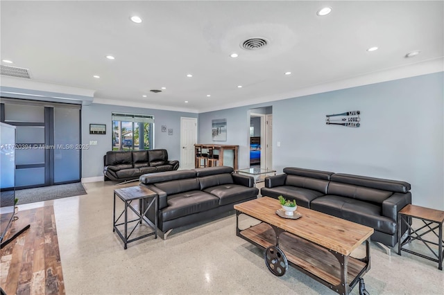 living room featuring crown molding