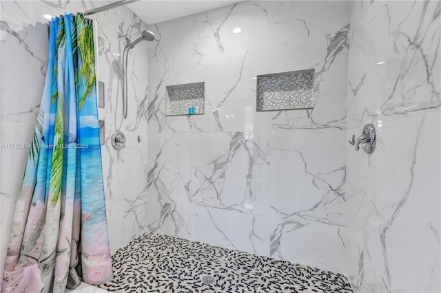 bathroom featuring a shower with curtain