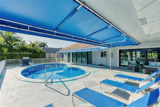 view of pool featuring an outdoor hangout area and a patio